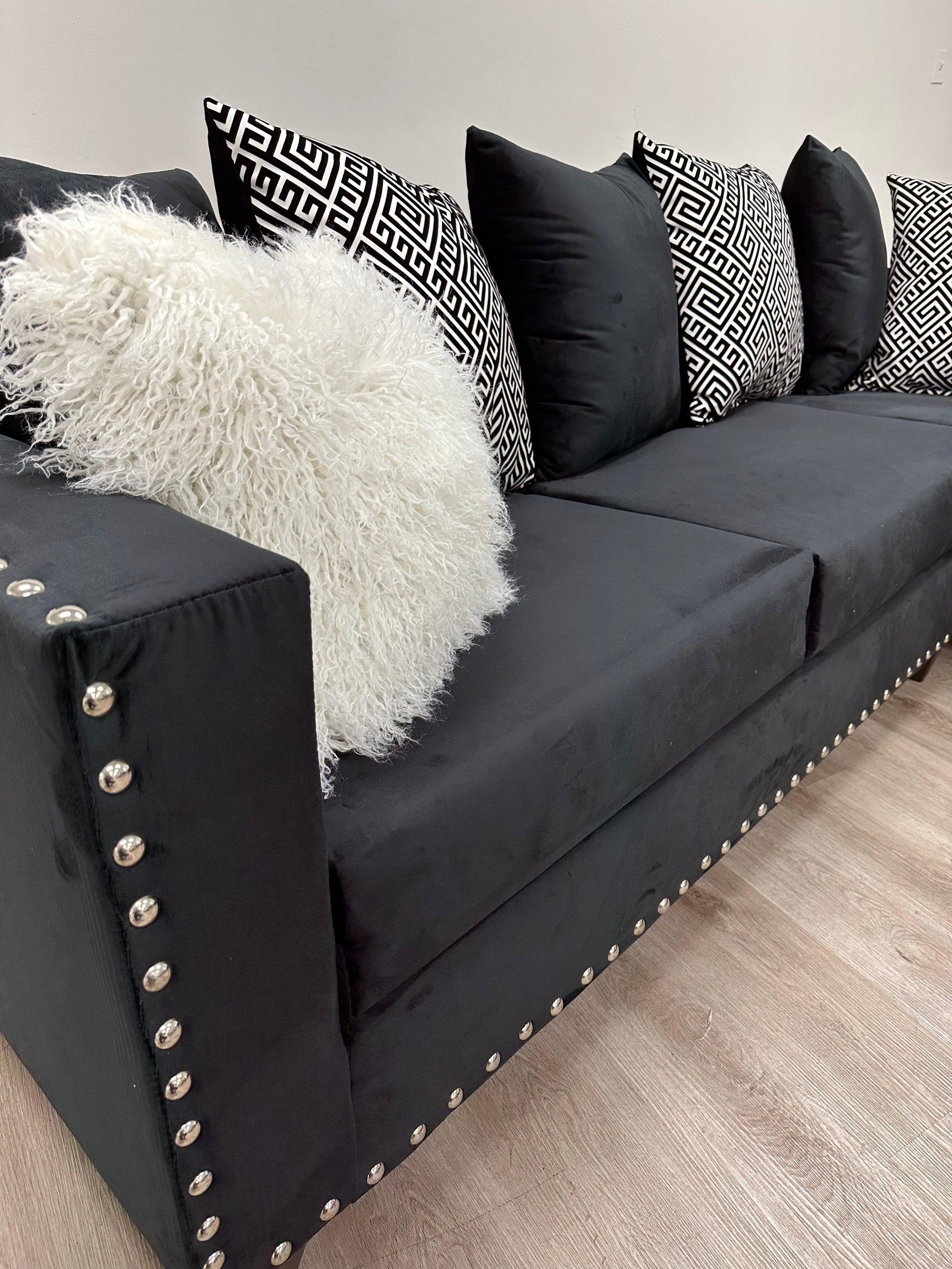 Side view of Santos Black Velvet Suede Sectional Sofa showing chaise and left-arm sofa