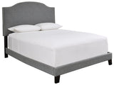 Close-up of Adelloni gray fabric upholstered queen bed headboard