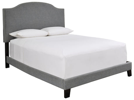 Close-up of Adelloni gray fabric upholstered queen bed headboard