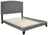 Detail of tufted fabric upholstery on Adelloni King Bed headboard