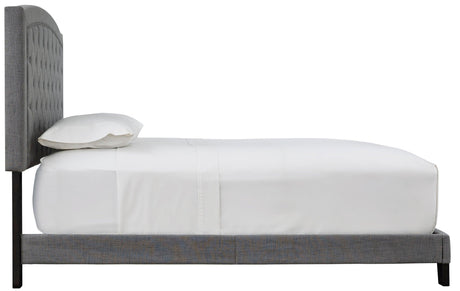 Full view of Adelloni Gray Tufted Platform King Bed in a bedroom setting