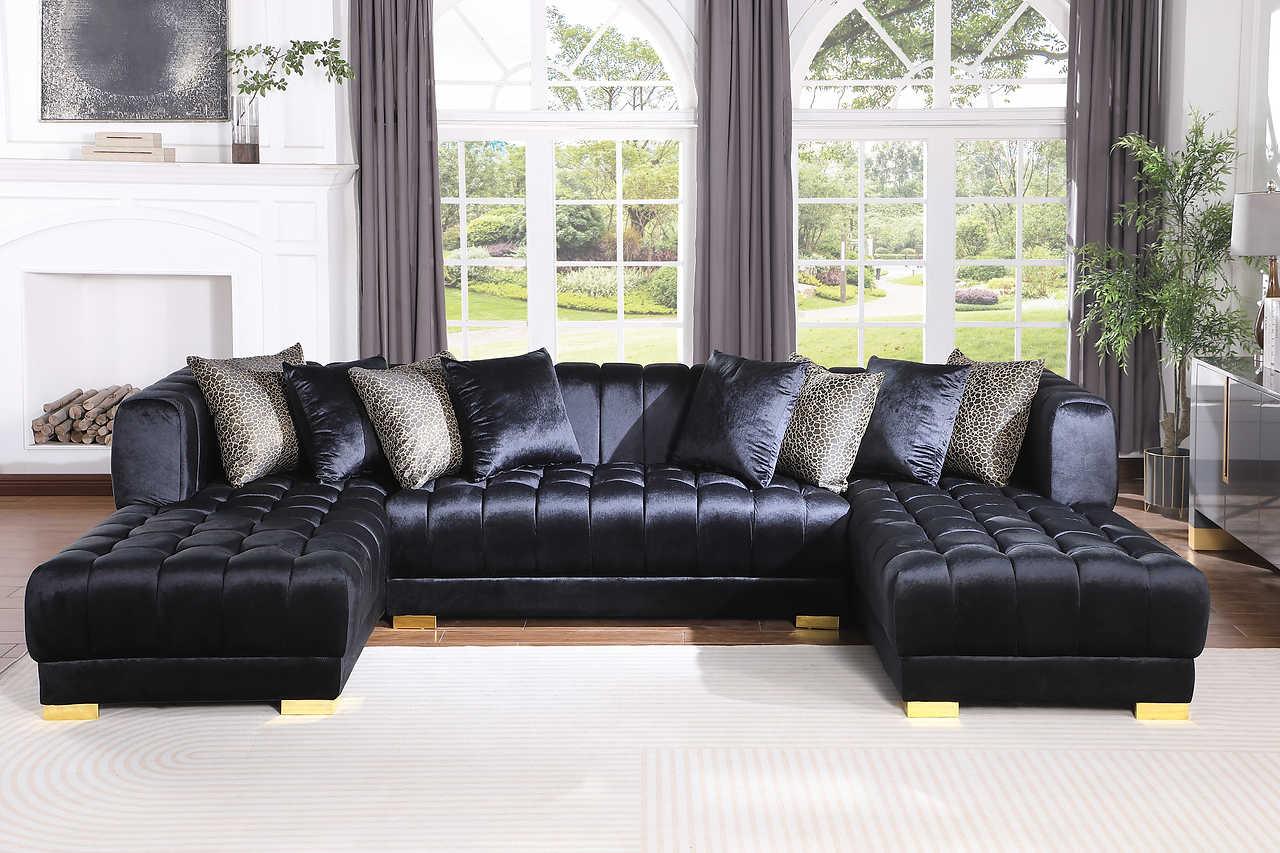 Side angle of Dasha Black Velvet Sectional Sofa showing gold legs