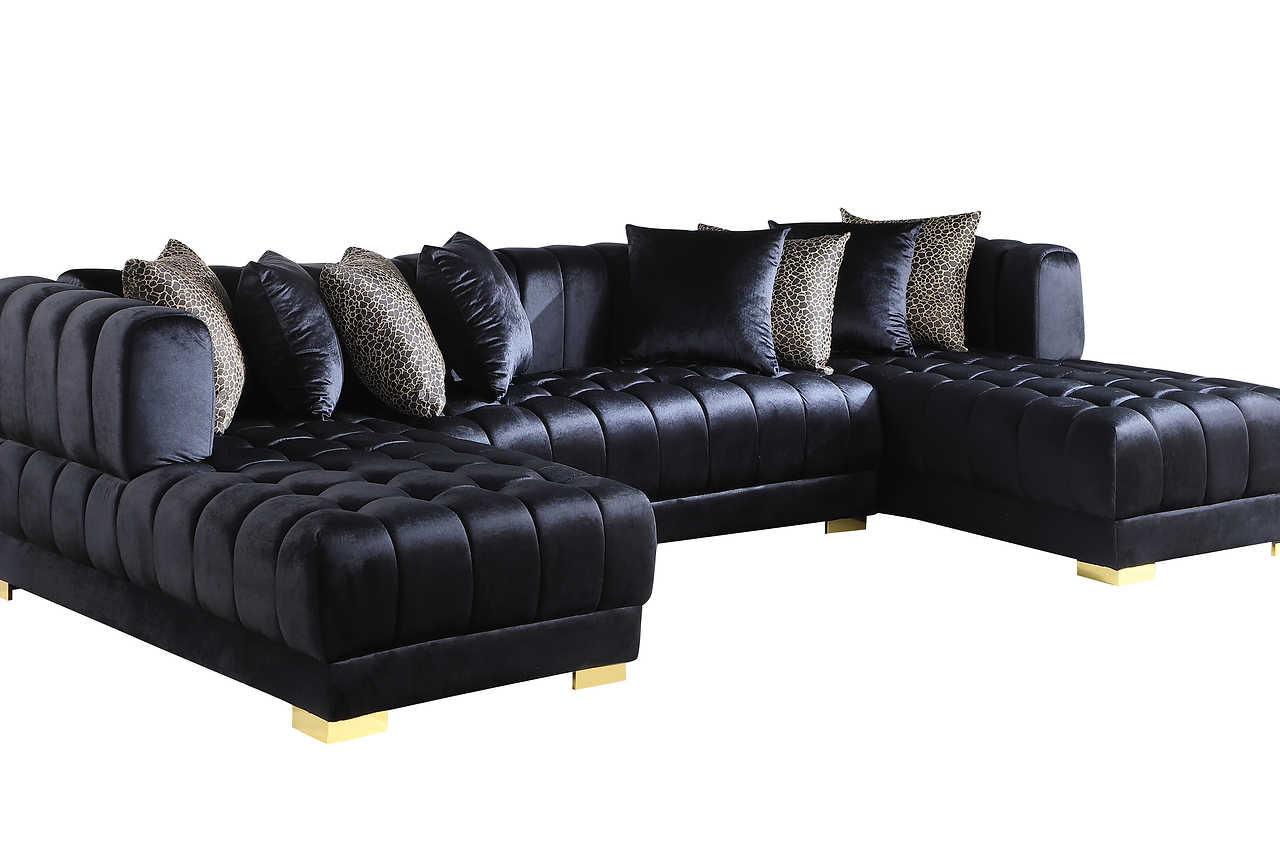 Close-up detail of black velvet fabric and gold legs on Dasha Sectional Sofa