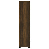 Dark pine media tower assembled in living room setting