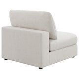 Serene beige upholstered armless chair showing plastic leveler feet