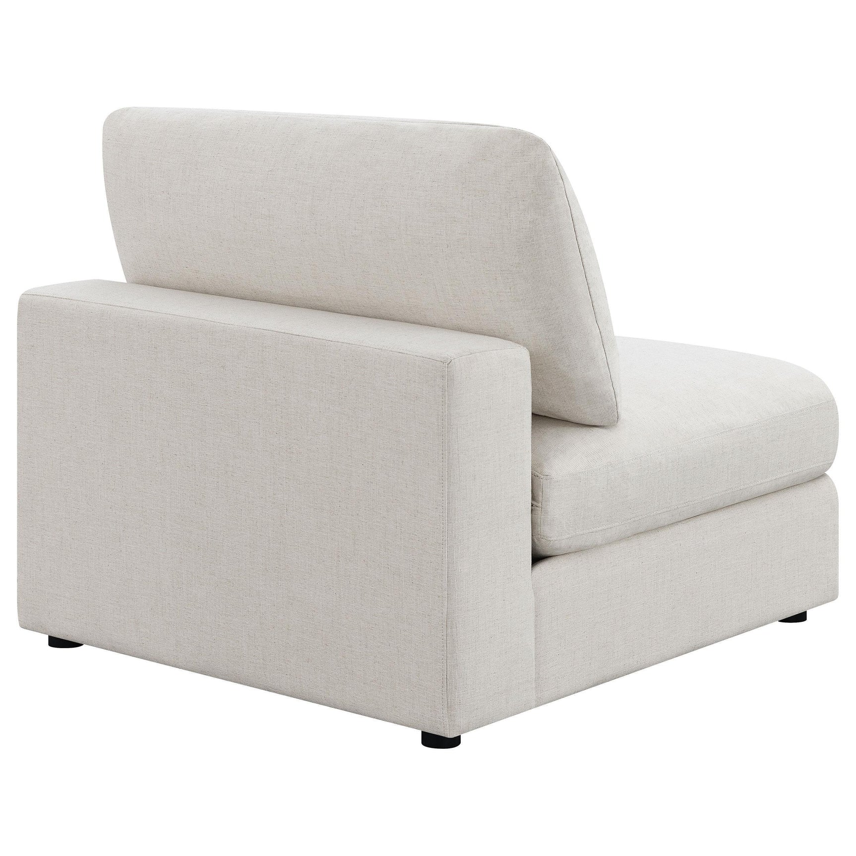 Serene beige upholstered armless chair showing plastic leveler feet
