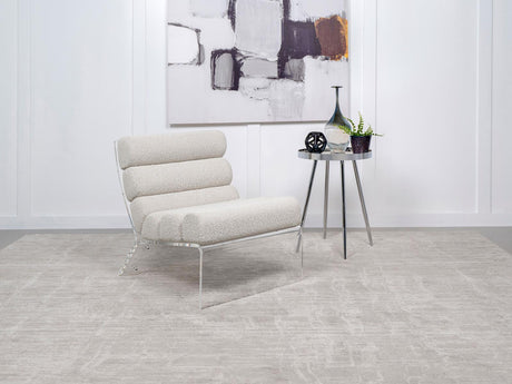 Side view of Serreta Boucle Upholstered Armless Accent Chair with clear acrylic frame in ivory