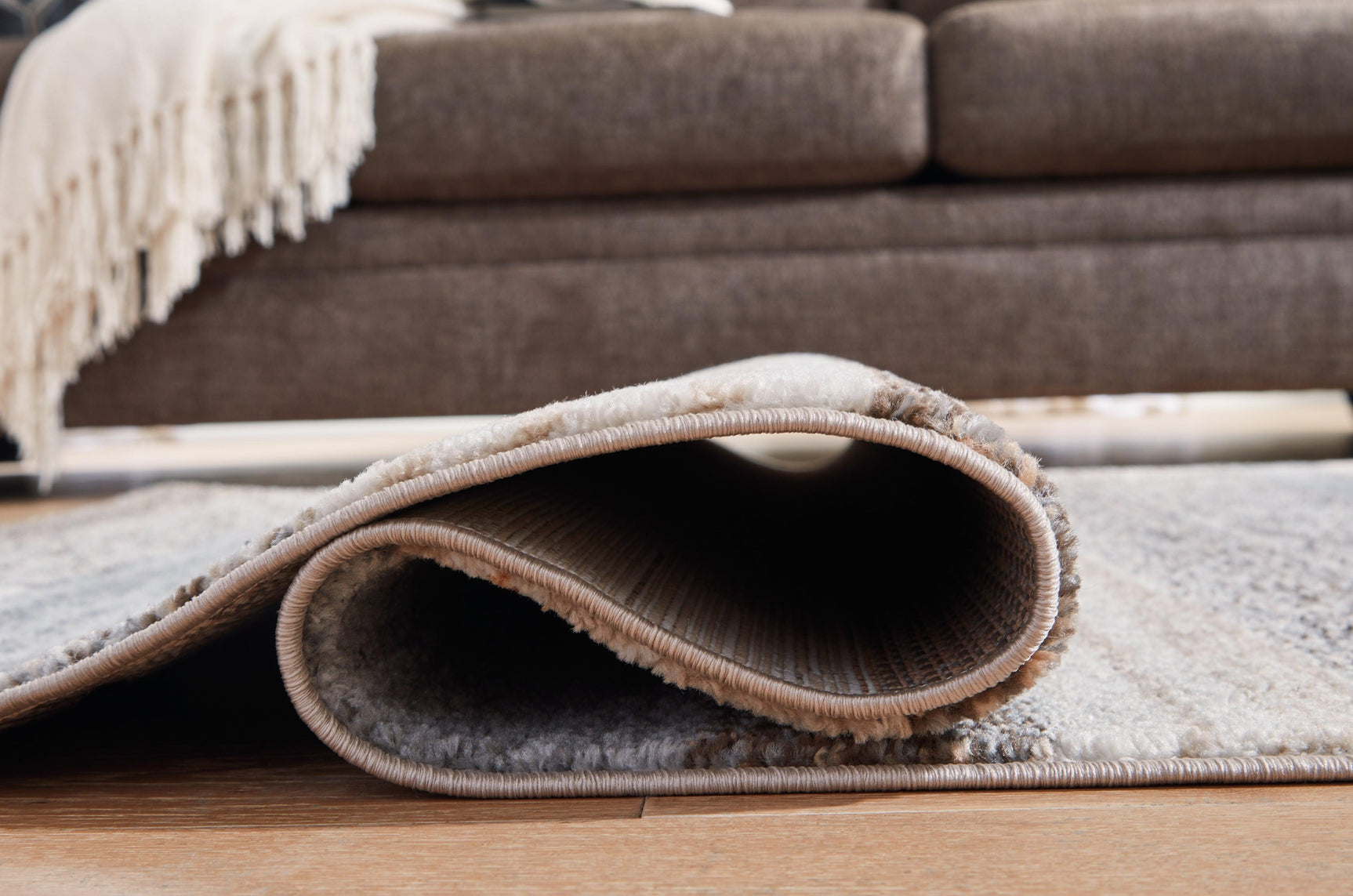 Sethburn Large Rug under coffee table with coordinating furniture