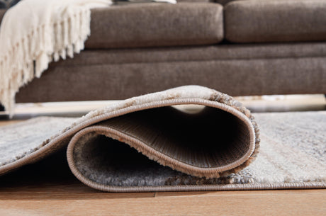 Sethburn Large Rug under coffee table with coordinating furniture