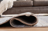 Sethburn Medium Rug laid flat in a room setting