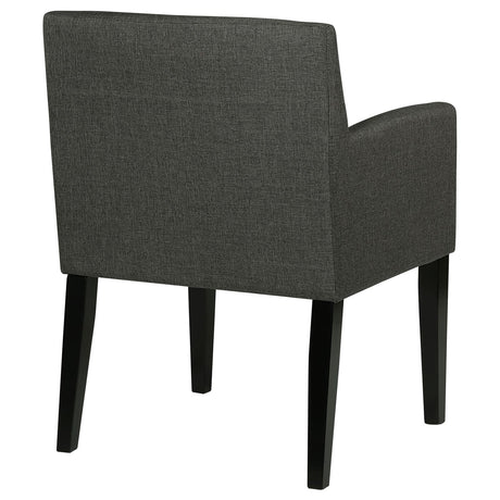 Catherine Grey Upholstered Dining Arm Chair on dining room floor