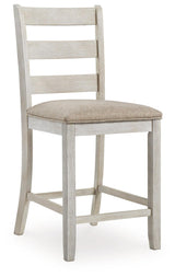 Set of 4 Distressed White Cushioned Barstools with Ladderback Design