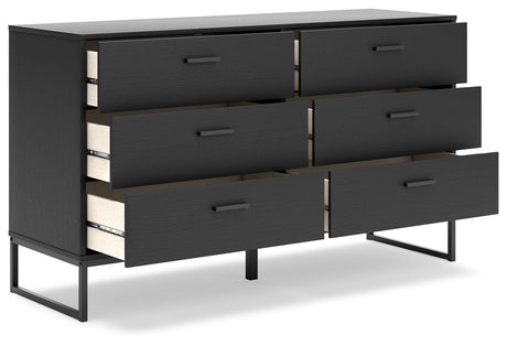 Close-up of dark pewter-tone metal drawer pulls on Socalle dresser