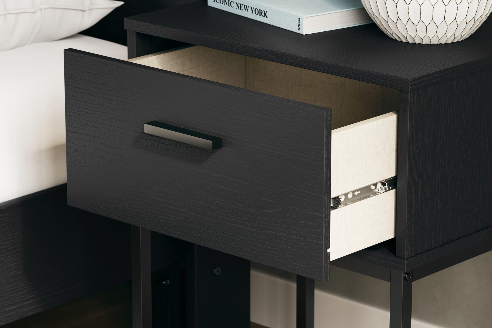 Close-up of matte black wood grain finish on Socalle Nightstand