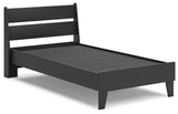 Close-up of matte black wood grain finish on bed frame