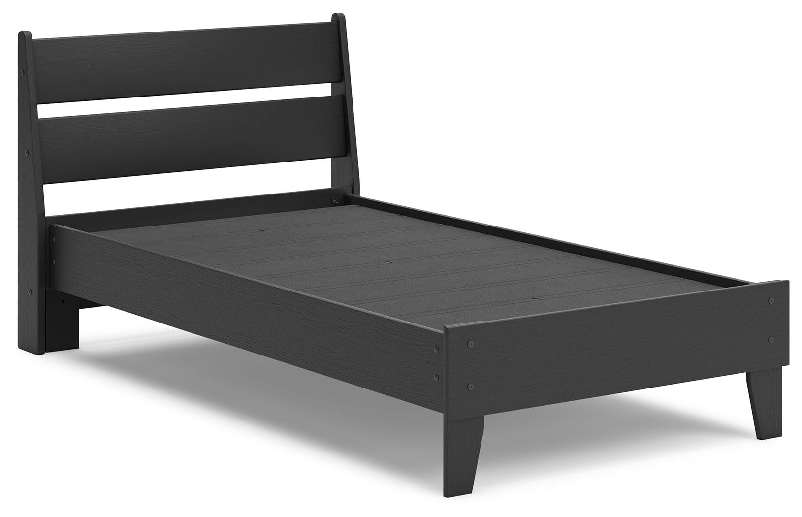 Close-up of matte black wood grain finish on bed frame