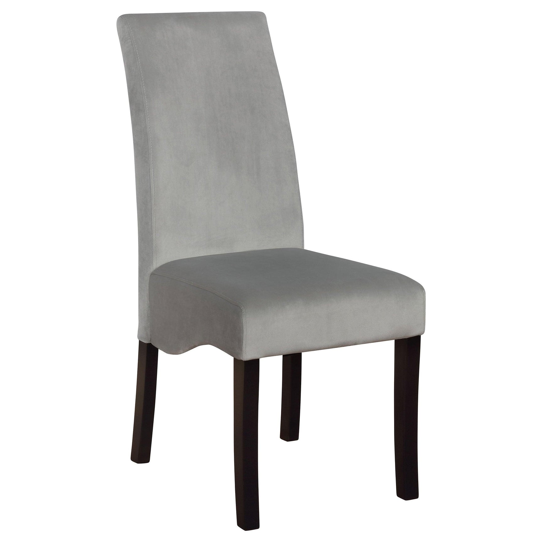 Detail view of black pedestal base and grey upholstered dining chairs