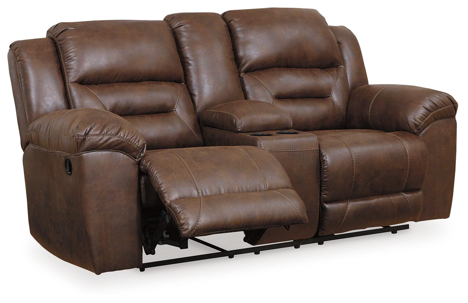 Stoneland reclining sofa and loveseat showing console center