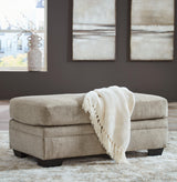 Stonemeade Taupe Chenille Ottoman - Ella Furniture