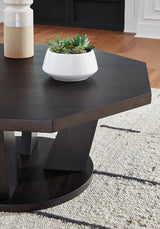 Close-up of Loma cocktail table showcasing octagonal top and trapezoid legs