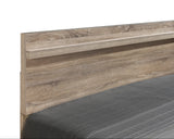 side view of Tilston Brown Bedroom Set bed