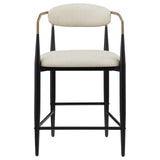 Close-up of beige upholstered seat and back on Tina metal bar stool