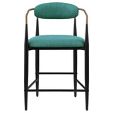 Tina metal base with footrest featured on green upholstered stool