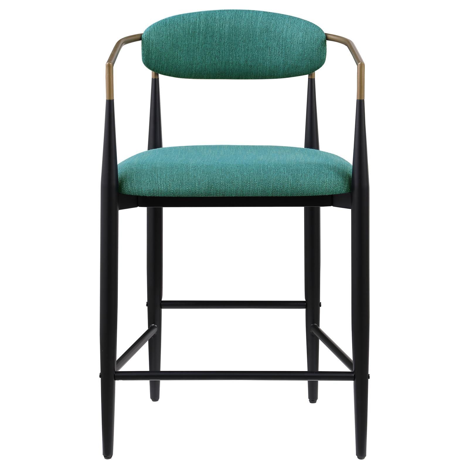 Tina metal base with footrest featured on green upholstered stool