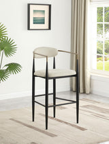 Side angle of Tina beige upholstered metal pub height bar stool
