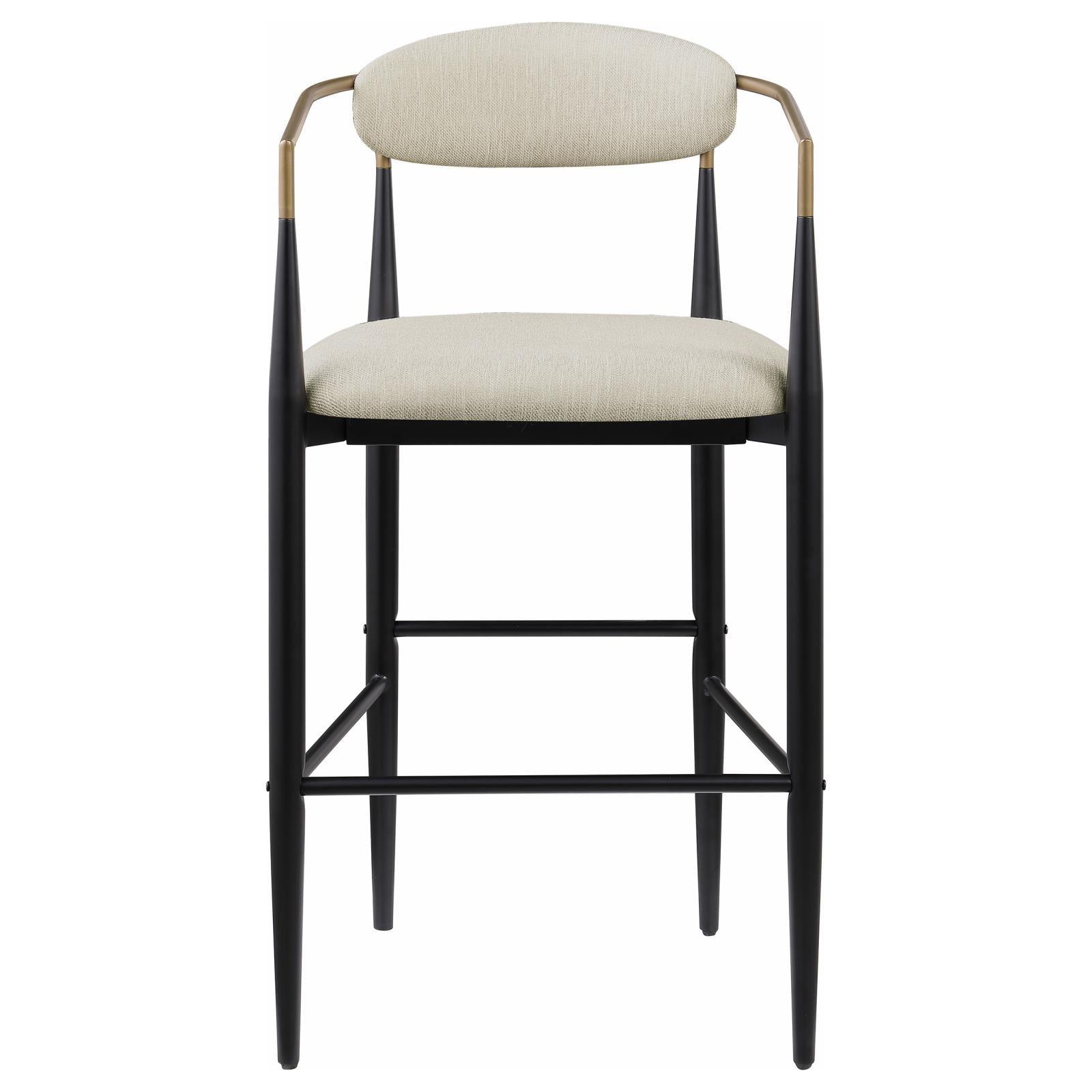 Close-up of fabric upholstery and armrest on Tina bar stool