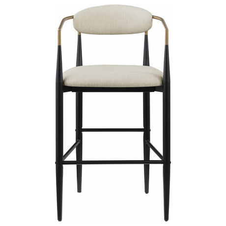 Close-up of fabric upholstery and armrest on Tina bar stool