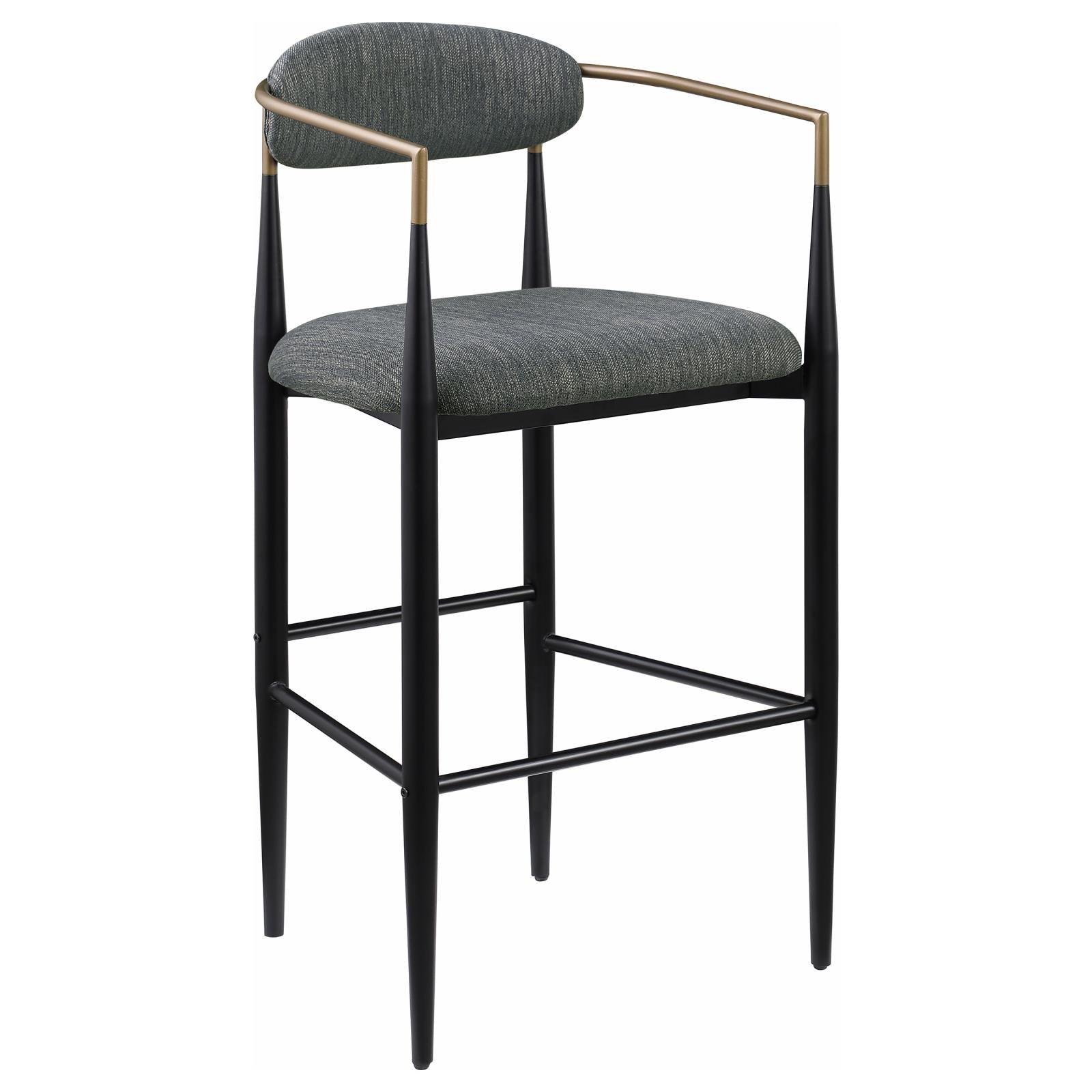 Close-up of Tina bar stool fabric upholstery and bentwood armrest