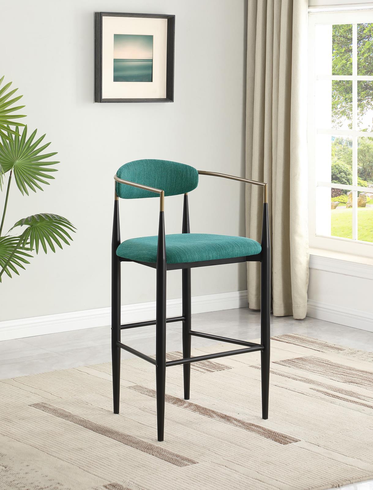 Side view of Tina green bar stool showing slender arms and tapered legs