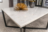 View of metal frame base with crisscross design under marble top