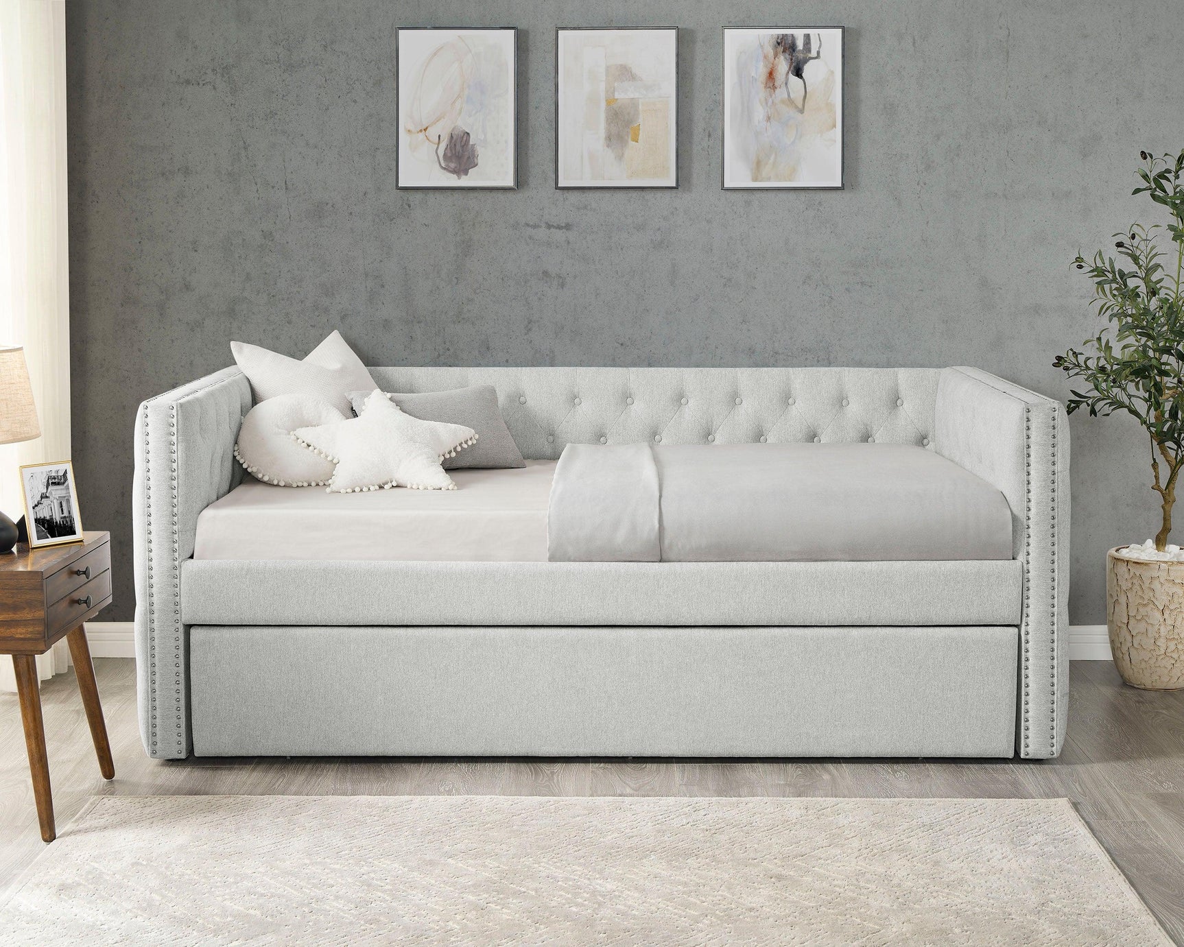Side view of Trina Dove Gray Upholstered Tufted Trundle Daybed