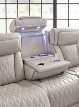 Armrest flip-top storage and cup holder detail