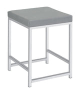 Umbridge vanity stool side view showing polished chrome legs
