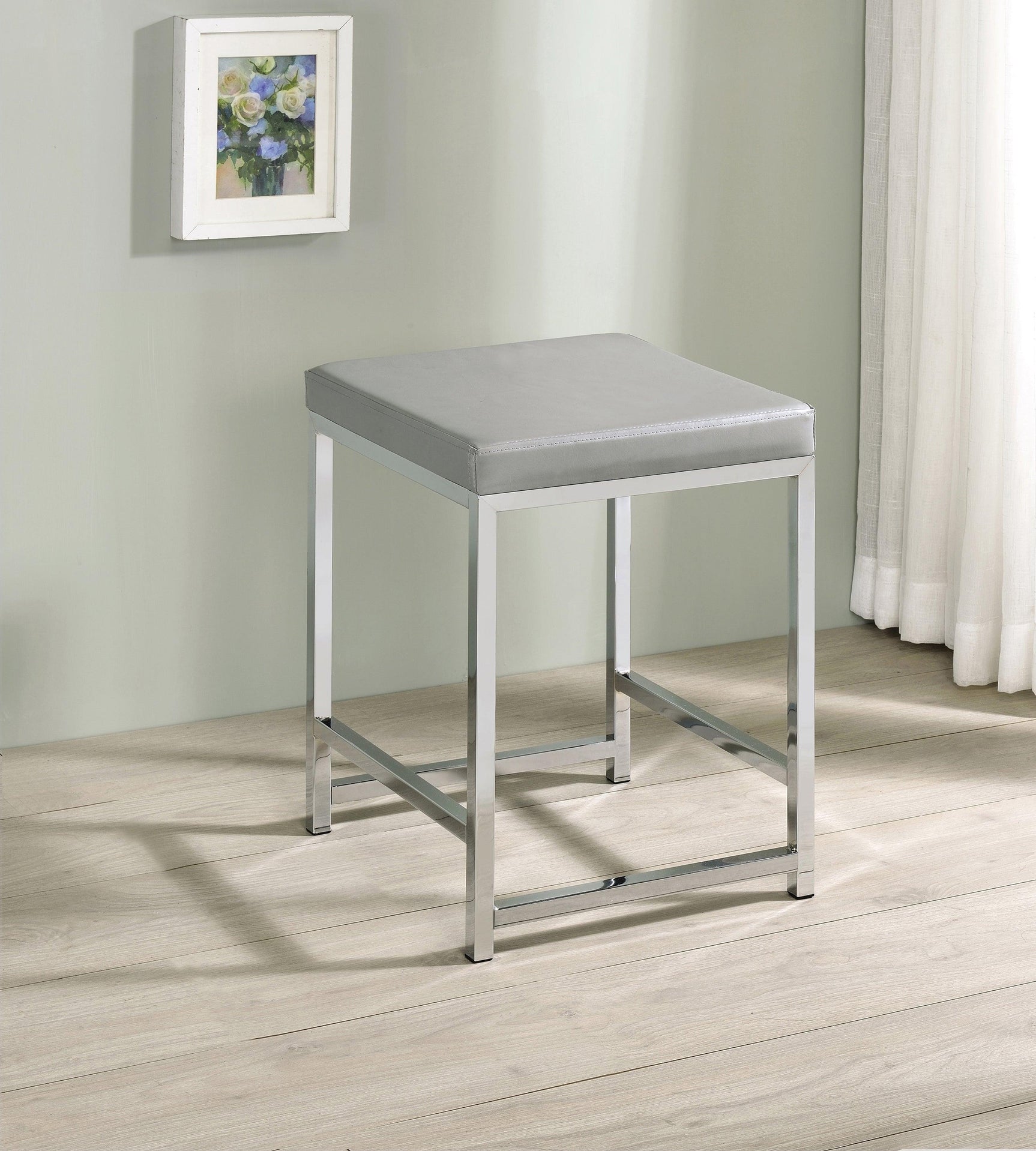Umbridge vanity stool angled view highlighting padded leatherette seat