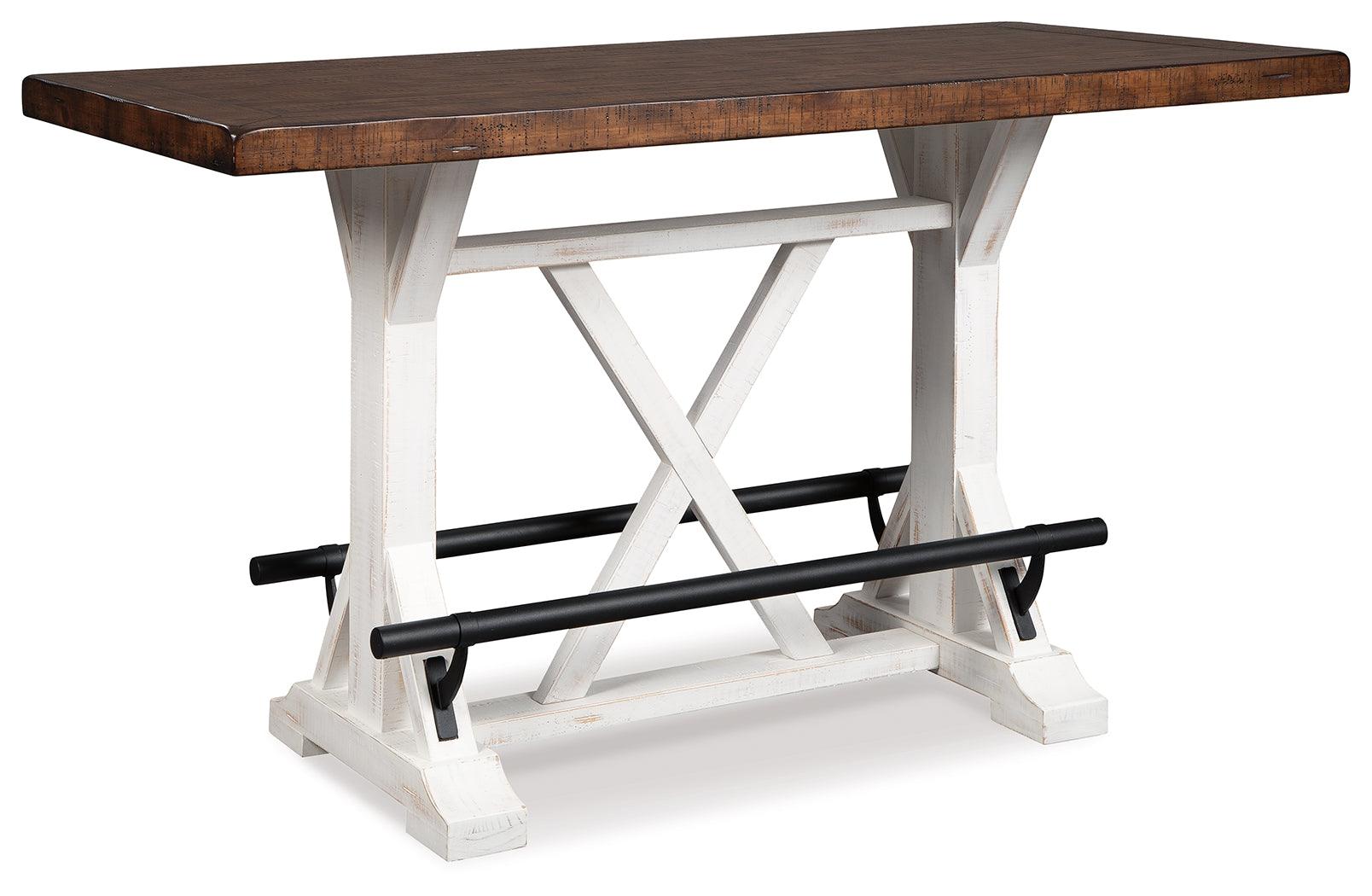 Side view of Valebeck counter height dining table showing black metal footrest