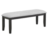 Close-up of gray tufted fabric upholstery on dining chair