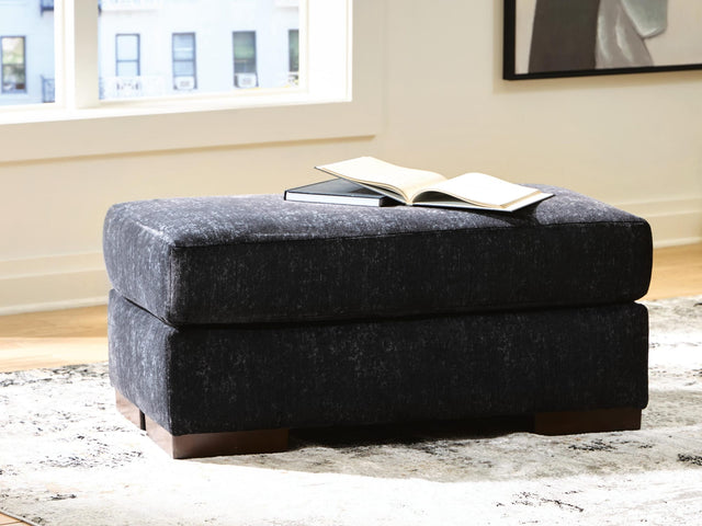 Whitmore Manor Black Pearl Chenille,Velvet Ottoman from Decor Furniture