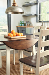 Woodanvill Cream Browne round dining room set front angle view