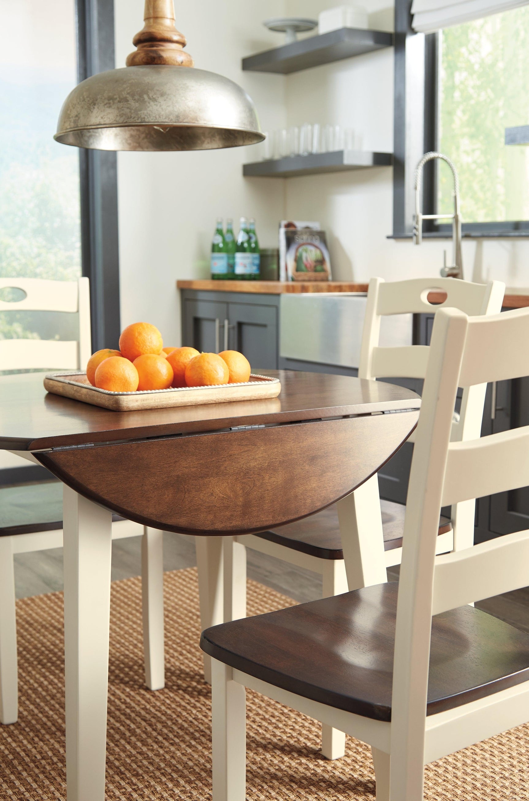 Woodanvill Cream Browne round dining room set front angle view