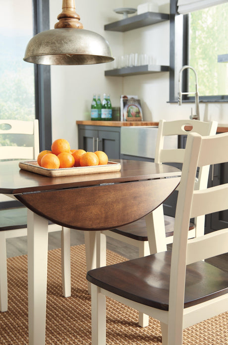 Woodanvill Cream Browne round dining room set front angle view